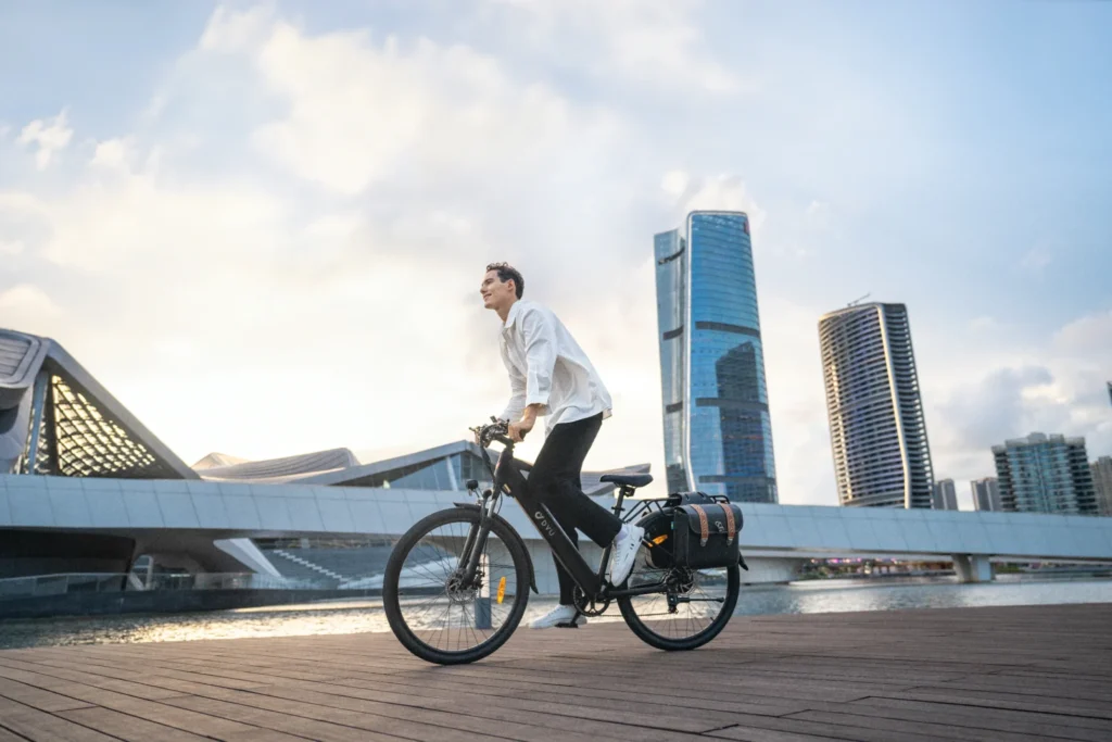 City e-bike rider on a waterfront route for a five-bike commuter comparison