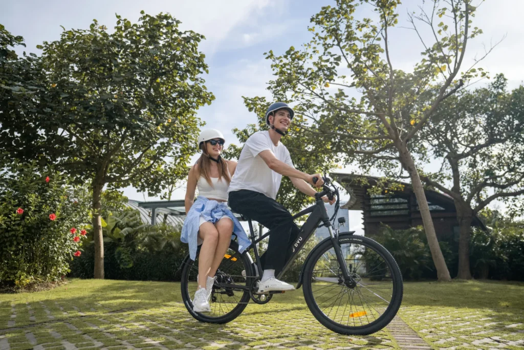 DYU C5 riders on a green park route for an e-bike tire width guide