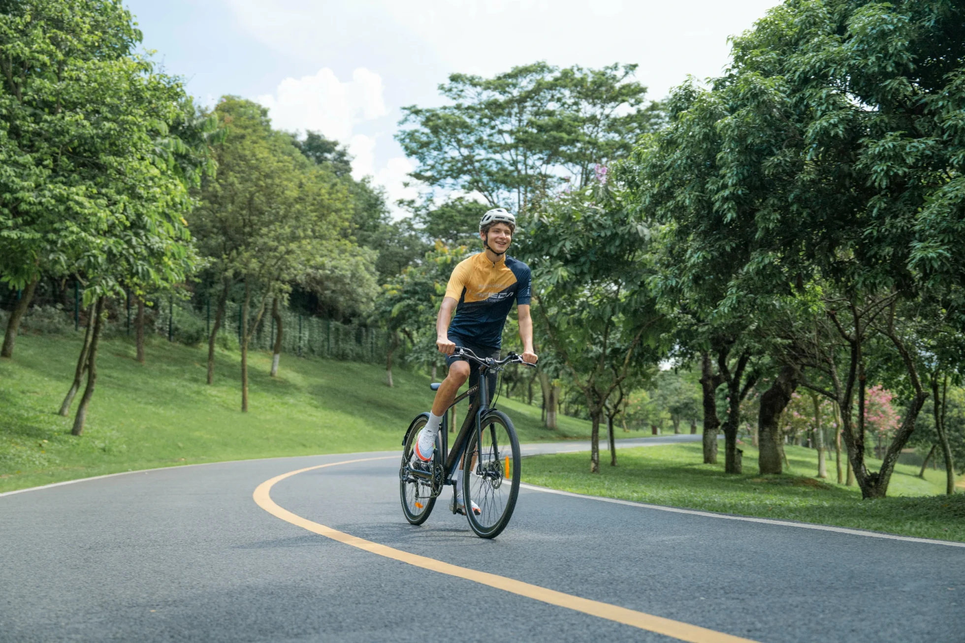 E-Bike Water Resistance Ratings: IP Codes Explained 2 DYU e-bike rider on a park path while wet-weather protection is considered