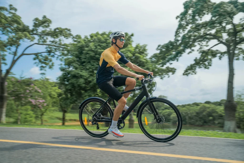 DYU e-bike in motion through a park for a water resistance buyer guide