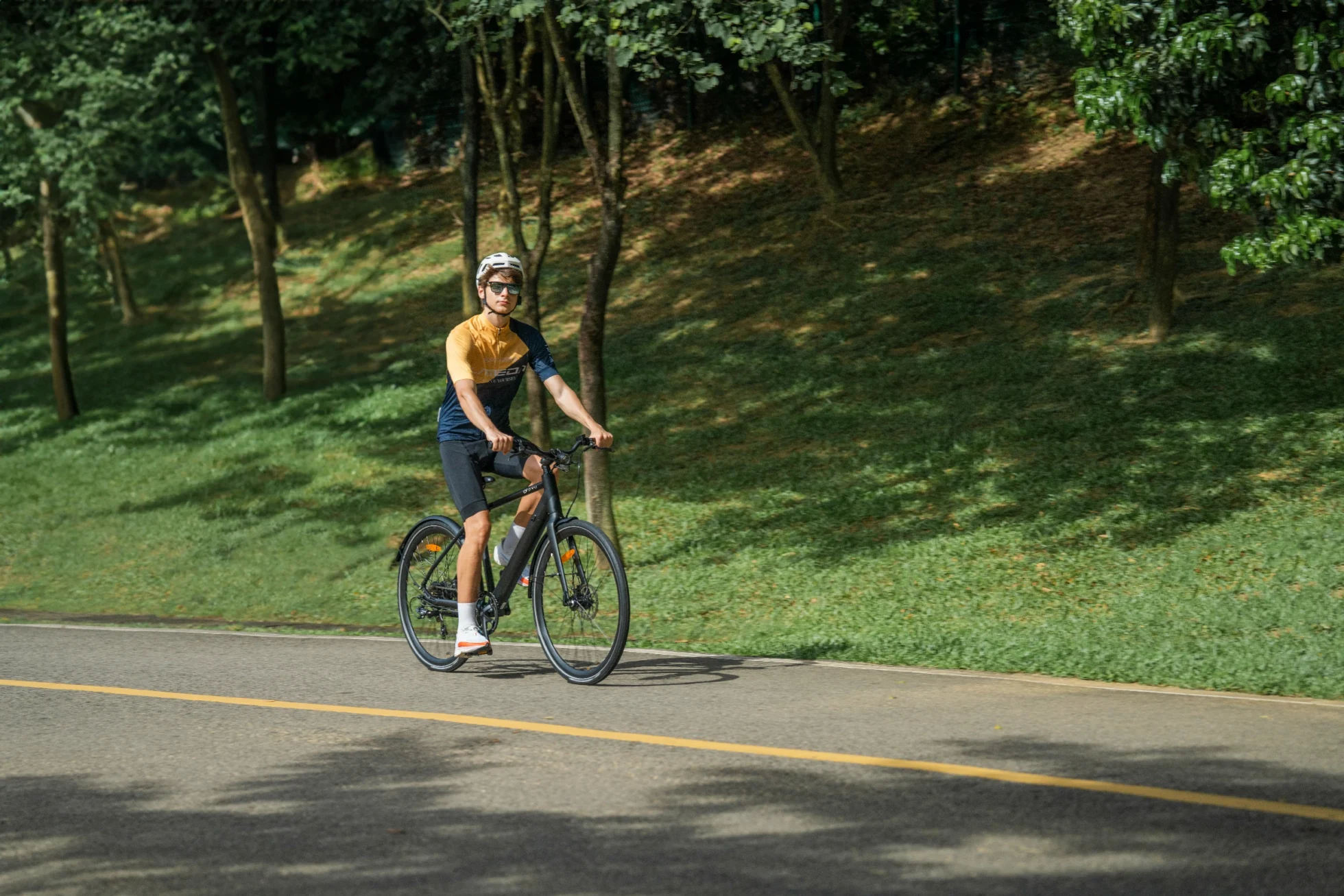 E-Bike Water Resistance Ratings: IP Codes Explained 5 DYU e-bike on a tree-lined route while cable and port protection are reviewed